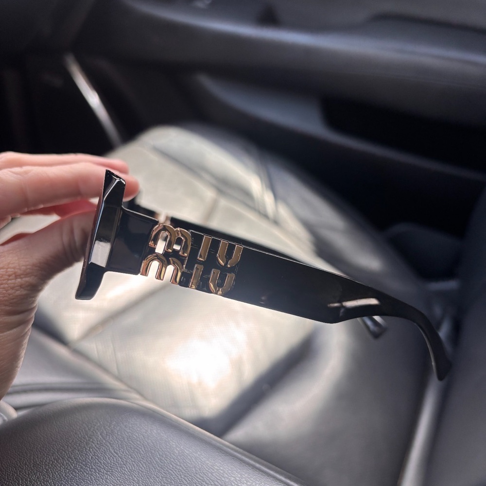 Miu Miu Black and Gold Sunglasses
